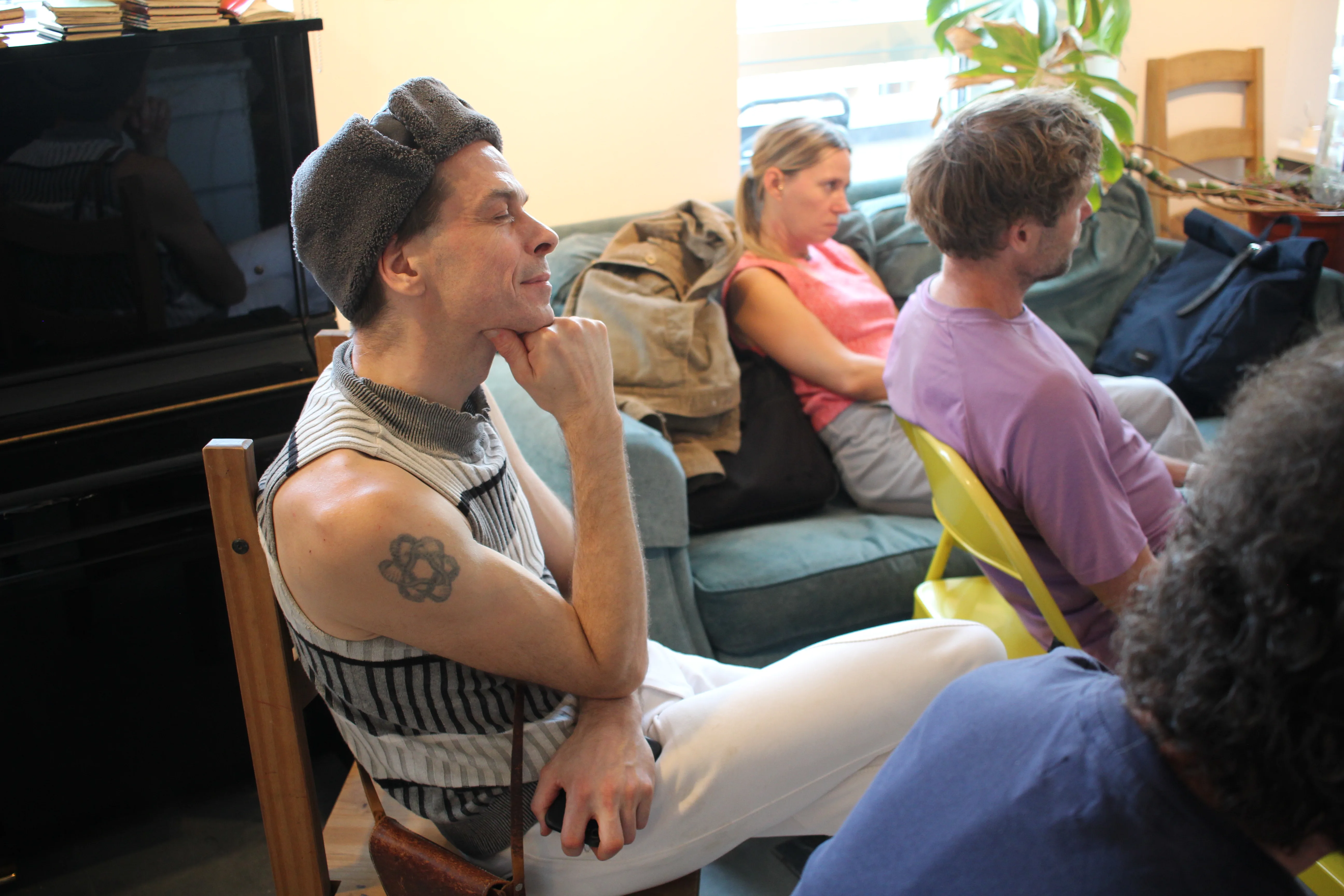 Speakers and audience during the poetry event