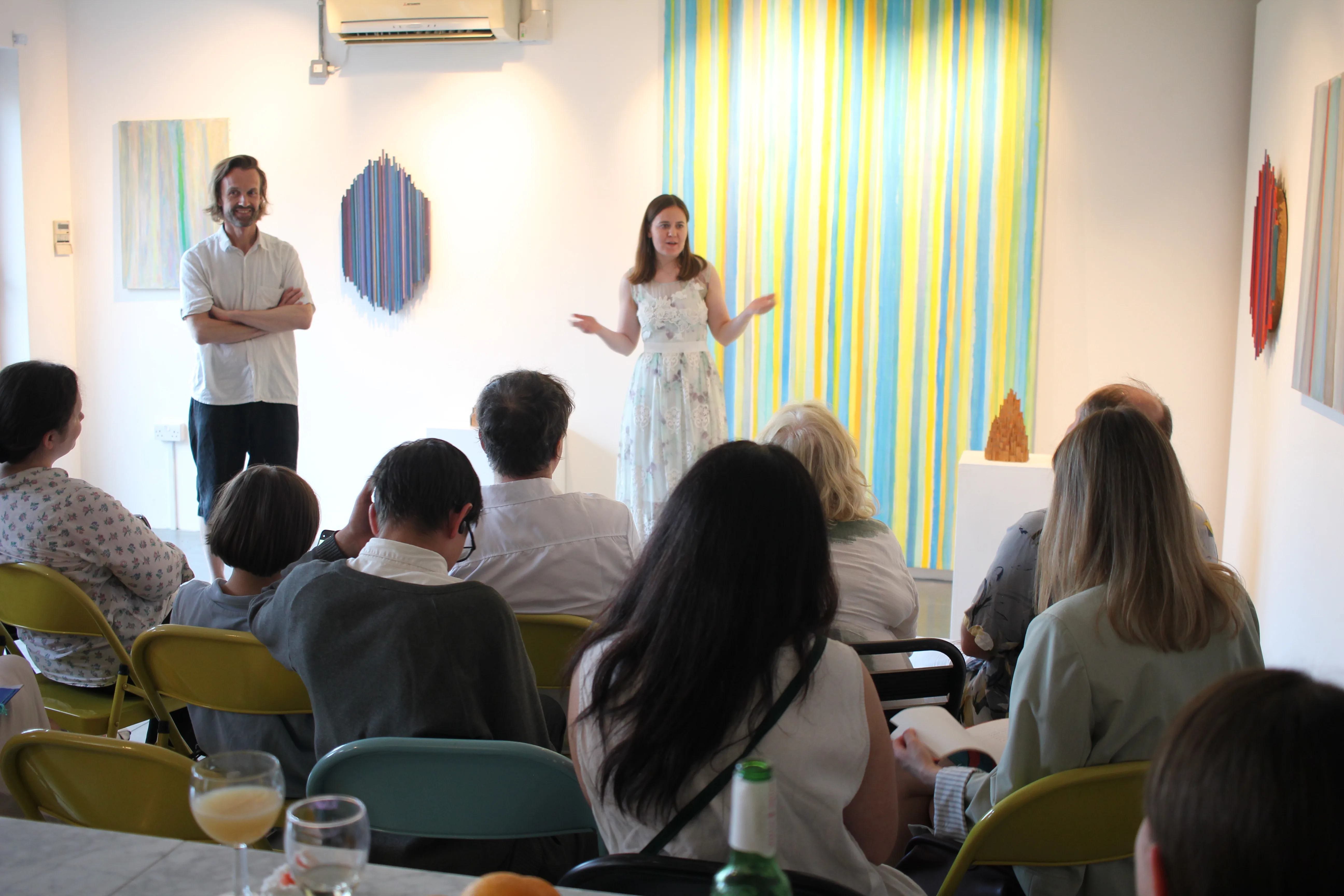 Guests in conversation after the poetry reading