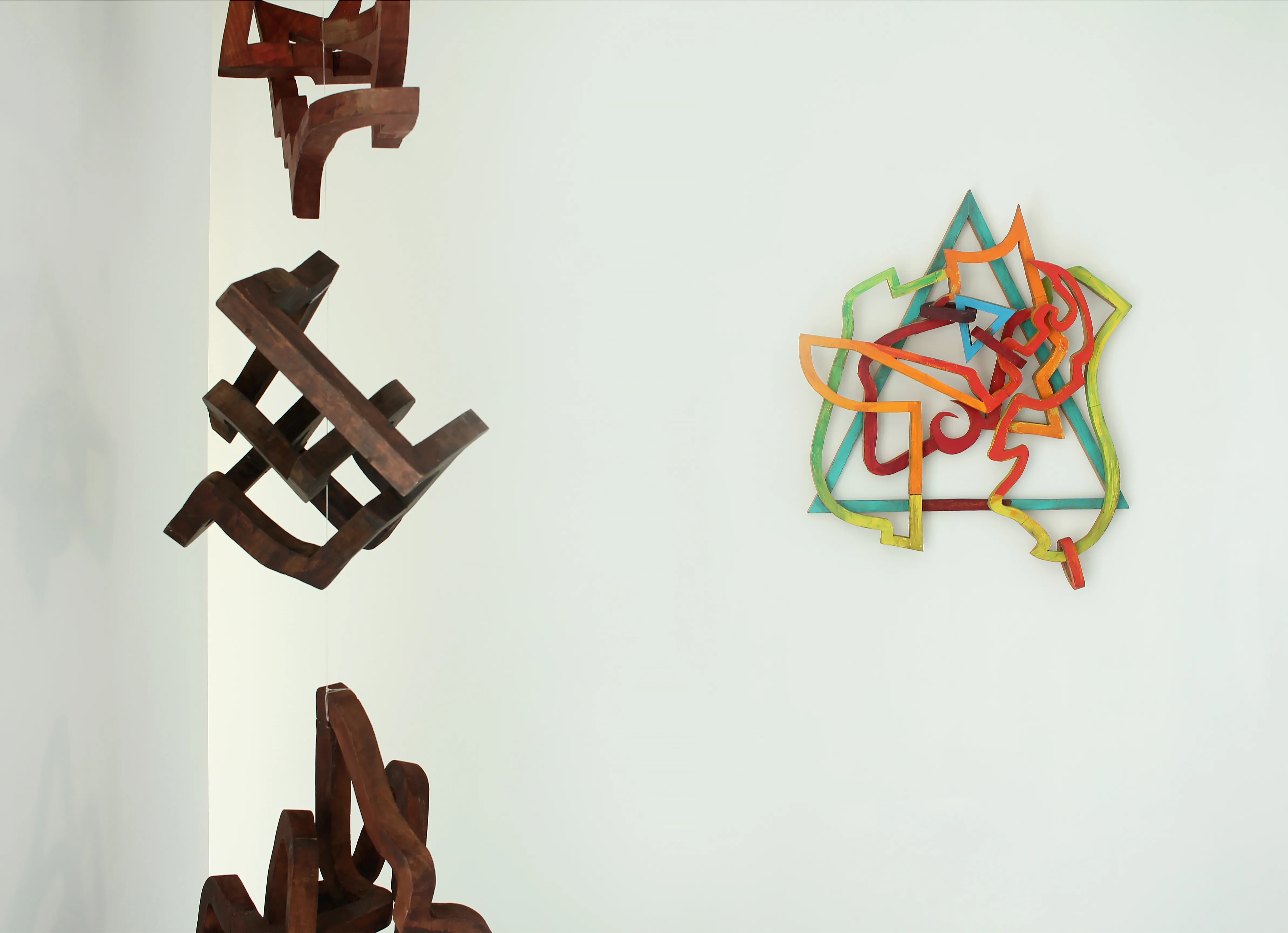 Wooden line sculptures by Oleg Prokofiev installed on white gallery walls