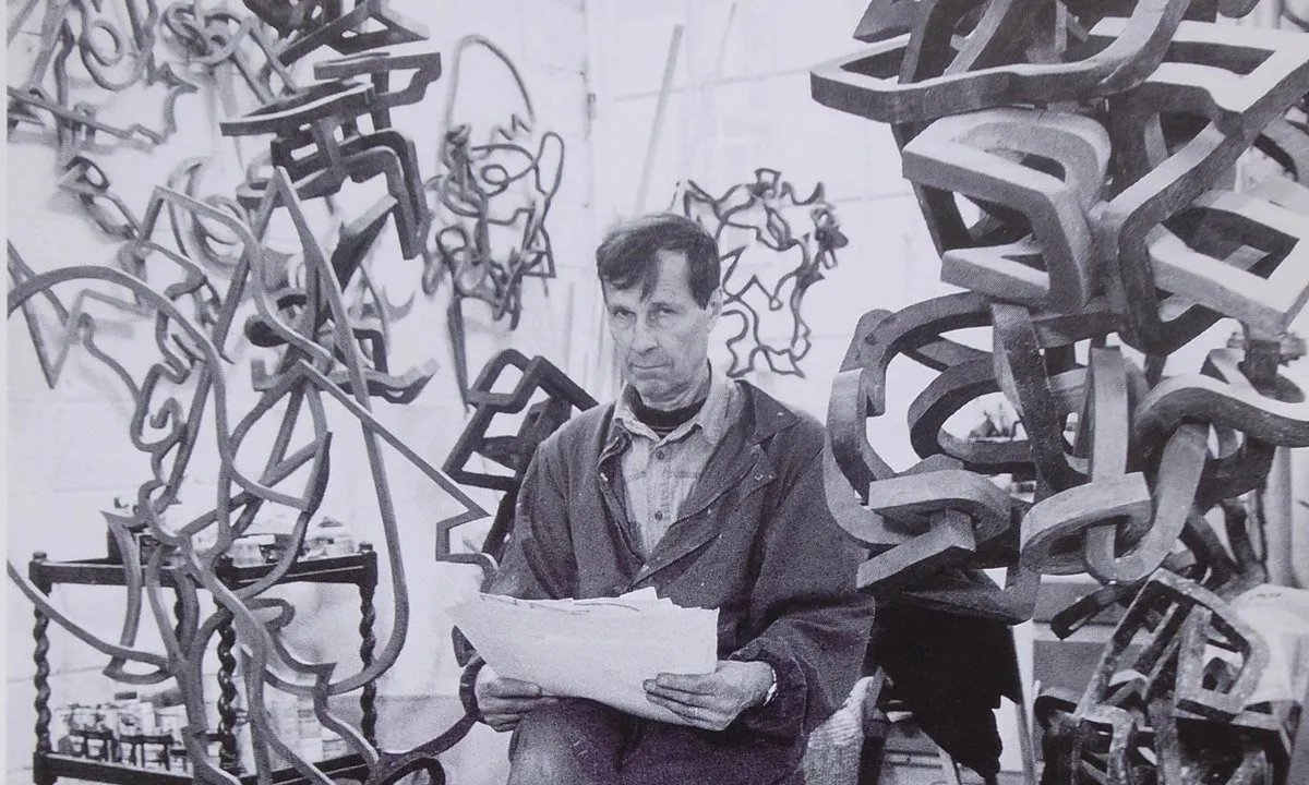 Oleg Prokofiev in his London studio, surrounded by wooden sculptures