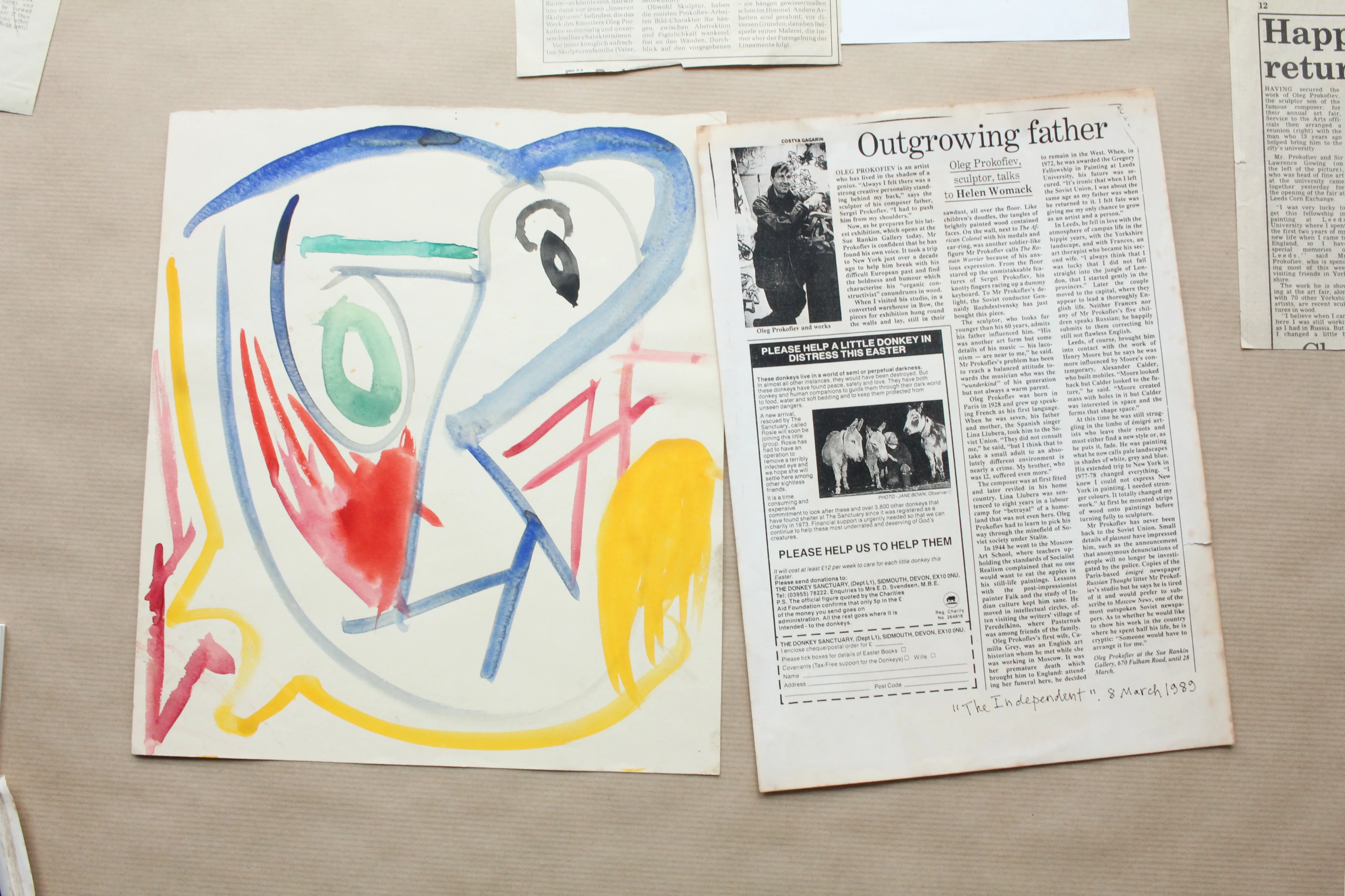 A colourful work on paper and press clippings from Oleg Prokofiev’s archive